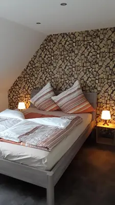 Ein Bett oder Betten in einem Zimmer der Unterkunft Ferienwohnung Harzer Wolf in Goslar/Sudmerberg