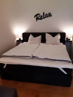 Ein Bett oder Betten in einem Zimmer der Unterkunft Aschenputtel