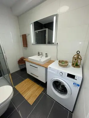 Ein Badezimmer in der Unterkunft Ferienwohnung Linda incl Pool, Sauna & Tiefgarage