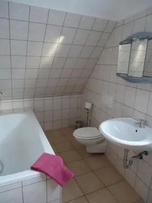 Ein Badezimmer in der Unterkunft Pension an der Stadtmauer Apartments