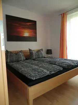 Ein Bett oder Betten in einem Zimmer der Unterkunft Ferienwohnung Am Wildmeisterweg