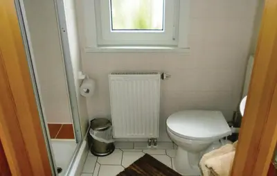 Ein Badezimmer in der Unterkunft Ferienhäuser J