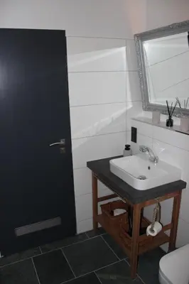 Ein Badezimmer in der Unterkunft Harzbutze 60
