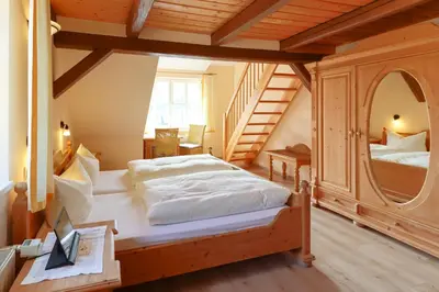 Ein Bett oder Betten in einem Zimmer der Unterkunft Am Anger