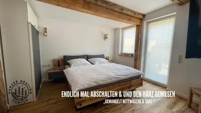 Ein Bett oder Betten in einem Zimmer der Unterkunft HARZER HEALING CENTER 2024 Gemütliche Landhauswohnung mit Fussbodenheizung,XXL Kochinsel,XXL Regenduschen,Modern,Hochwertig,Persönlich,Vollausgestattet