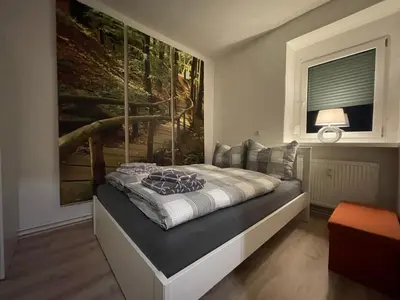Ein Bett oder Betten in einem Zimmer der Unterkunft Ferienwohnung Jagemann