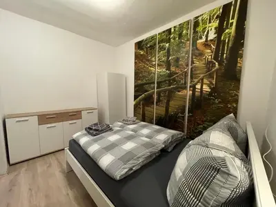 Ein Bett oder Betten in einem Zimmer der Unterkunft Ferienwohnung Jagemann