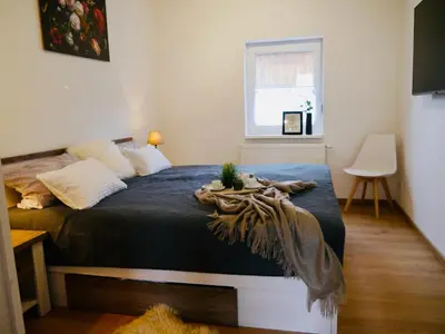 Ein Bett oder Betten in einem Zimmer der Unterkunft FeWo Fichte mit Balkon #Netflix #Innestadtnähe von Harztraveler