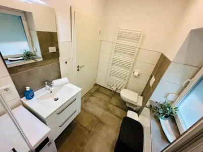 Ein Badezimmer in der Unterkunft FeWo Buche mit Balkon #Netflix #Innenstadtnähe von Harztraveler