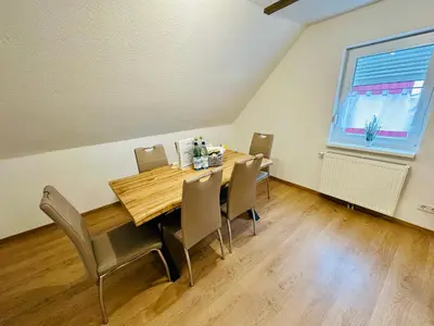 Ein Sitzbereich in der Unterkunft FeWo Bergahorn mit Wintergarten #Fernblick#Netflix und vieles mehr von Harztraveler