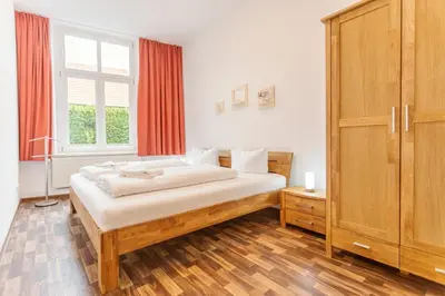 Ein Bett oder Betten in einem Zimmer der Unterkunft WR Rote Ferienwohnung in der alten Apotheke