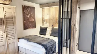 Ein Bett oder Betten in einem Zimmer der Unterkunft HOME Suites Panoramablick mit Sauna