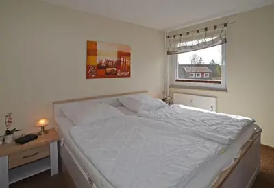 Ein Bett oder Betten in einem Zimmer der Unterkunft Fewo Vierjahreszeiten