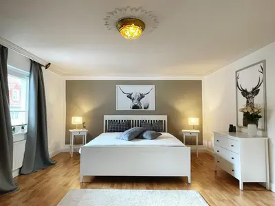 Ein Bett oder Betten in einem Zimmer der Unterkunft Ferienwohnung: Villa Eichbaum