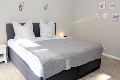Ein Bett oder Betten in einem Zimmer der Unterkunft Am Stadtpark