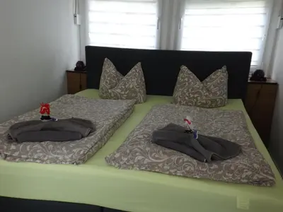 Ein Bett oder Betten in einem Zimmer der Unterkunft Harzhaus Bungalow Waldblick