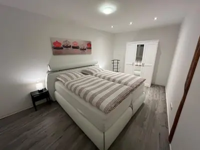 Ein Bett oder Betten in einem Zimmer der Unterkunft Am Jacobsgarten