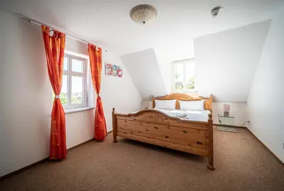 Ein Bett oder Betten in einem Zimmer der Unterkunft Murphy's Zimmer und Apartments