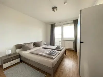 Ein Bett oder Betten in einem Zimmer der Unterkunft Ferienwohnung Heidebreite