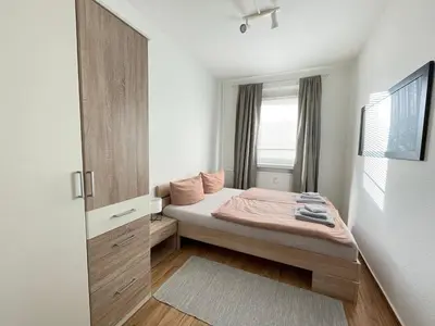 Ein Bett oder Betten in einem Zimmer der Unterkunft Ferienwohnung Heidebreite