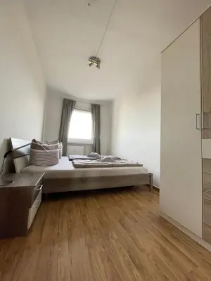 Ein Bett oder Betten in einem Zimmer der Unterkunft Ferienwohnung Heidebreite