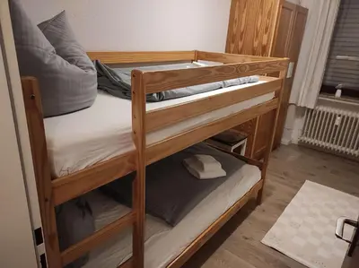 Ein Bett oder Betten in einem Zimmer der Unterkunft Ferienwohnung Rehkitz