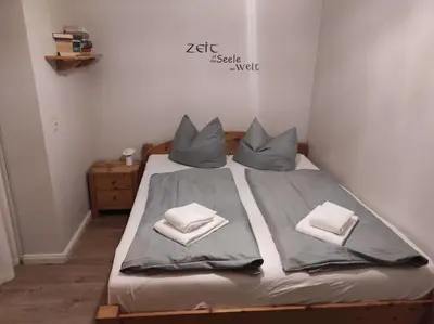 Ein Bett oder Betten in einem Zimmer der Unterkunft Ferienwohnung Rehkitz