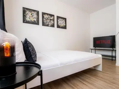 Ein Bett oder Betten in einem Zimmer der Unterkunft EUPHORAS - Gemütliches Apartment in zentraler Lage