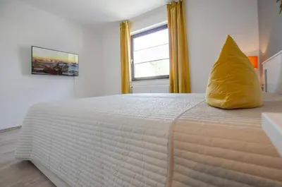 Ein Bett oder Betten in einem Zimmer der Unterkunft FeWo Tante Clara