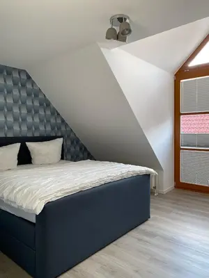 Ein Bett oder Betten in einem Zimmer der Unterkunft Harzzeit Home
