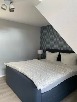 Ein Bett oder Betten in einem Zimmer der Unterkunft Harzzeit Home