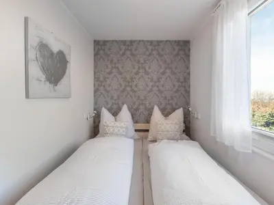 Ein Bett oder Betten in einem Zimmer der Unterkunft Ferienwohnung mit Sauna in Ballenstedt