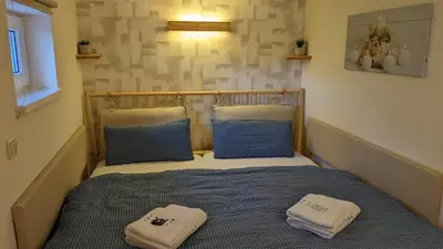 Ein Bett oder Betten in einem Zimmer der Unterkunft WeisseVilla Friedrichsbrunn Das Weisse Haus