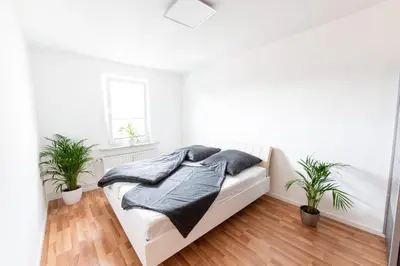 Ein Bett oder Betten in einem Zimmer der Unterkunft Ferienwohnung Martin 3 und 4