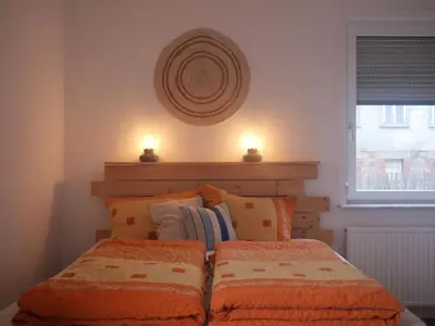 Ein Bett oder Betten in einem Zimmer der Unterkunft Rustikale Ferienwohnung mit Kamin