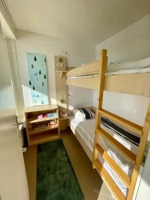 Ein Bett oder Betten in einem Zimmer der Unterkunft Schöne Ferienwohnung mit Schwimmbad, Sauna und Balkon
