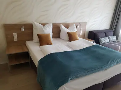 Ein Bett oder Betten in einem Zimmer der Unterkunft FeWo Nina Exklusiv Design mit Bergblick
