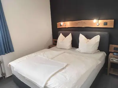 Ein Bett oder Betten in einem Zimmer der Unterkunft Ferienwohnung Harzer Horst