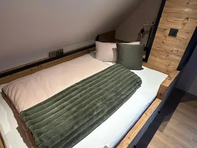 Ein Bett oder Betten in einem Zimmer der Unterkunft Ferienhaus Harzglück