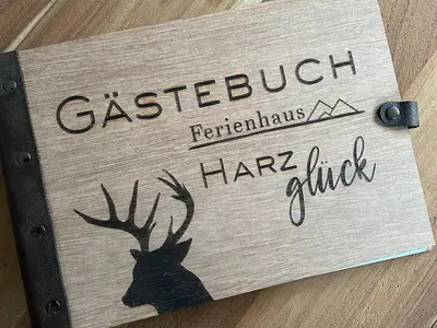 Ein Zertifikat, Auszeichnung, Logo oder anderes Dokument, das in der Unterkunft Ferienhaus Harzglück ausgestellt ist