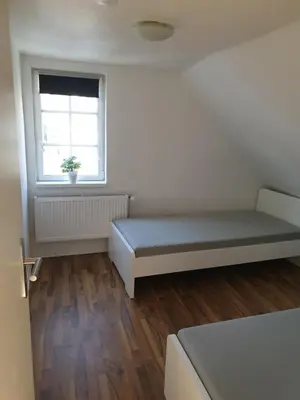 Ein Bett oder Betten in einem Zimmer der Unterkunft Ferienwohnung Leonie