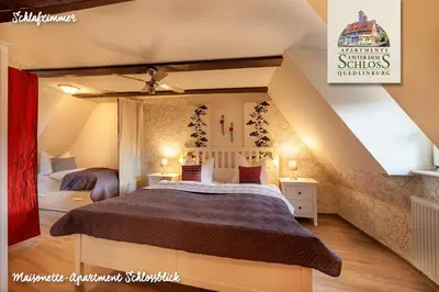 Ein Bett oder Betten in einem Zimmer der Unterkunft Apartments Unter Dem Schloß