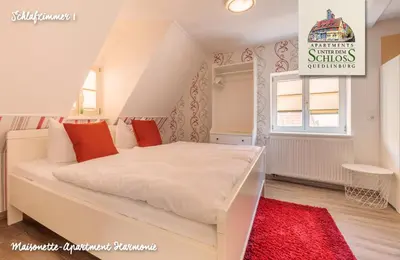 Ein Bett oder Betten in einem Zimmer der Unterkunft Apartments Unter Dem Schloß