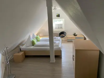 Ein Bett oder Betten in einem Zimmer der Unterkunft Steinmännchen Ferienwohnung