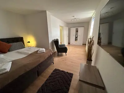 Ein Bett oder Betten in einem Zimmer der Unterkunft FeWo Wanderlust #Innenstadt#Außenbereich#ruhige Lage von Harztraveler