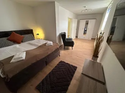 Ein Bett oder Betten in einem Zimmer der Unterkunft FeWo Wanderlust #Innenstadt#Außenbereich#ruhige Lage von Harztraveler