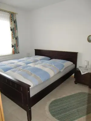 Ein Bett oder Betten in einem Zimmer der Unterkunft Fewo Eiche