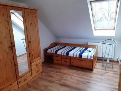 Ein Bett oder Betten in einem Zimmer der Unterkunft Ferienwohnung Günther am Park