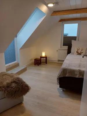 Ein Bett oder Betten in einem Zimmer der Unterkunft Ferienwohnung am Jungbrunnen 3