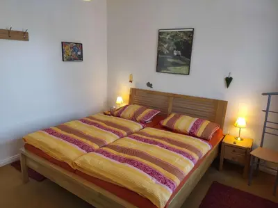 Ein Bett oder Betten in einem Zimmer der Unterkunft Ferienwohnung Villa Specht